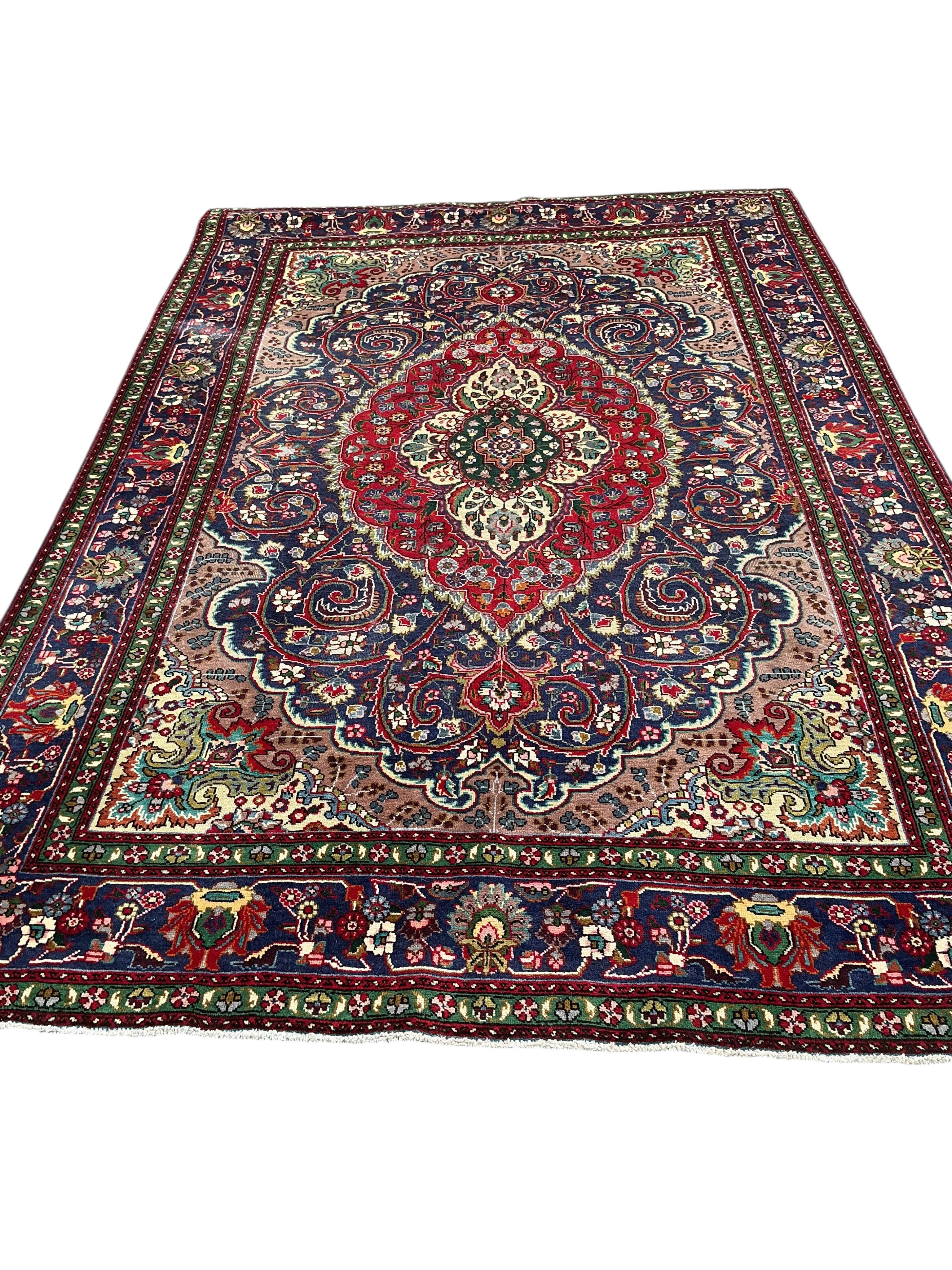 A Tabriz blue ground carpet, 292 x 205cm